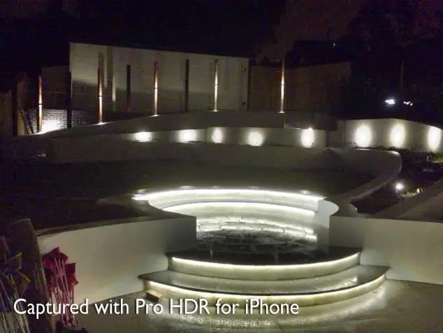 Curved lit steps and walls at night