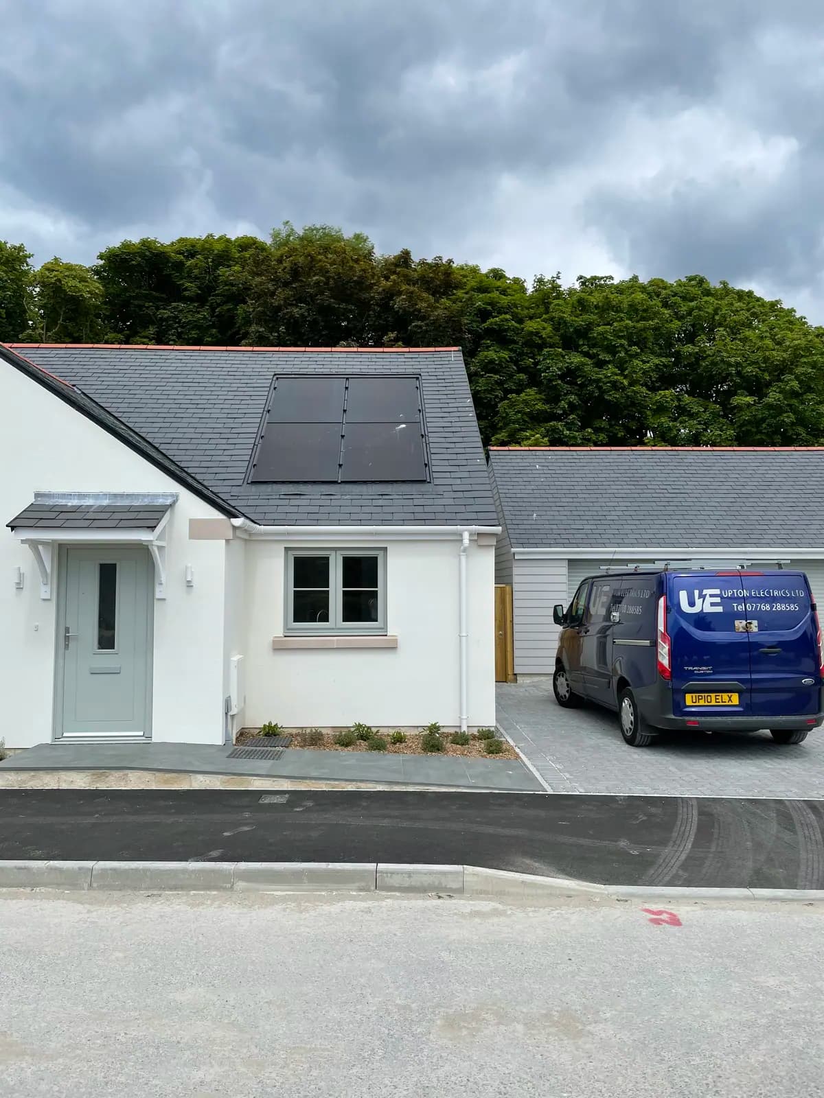 Upton Electrics solar panel installation with company van