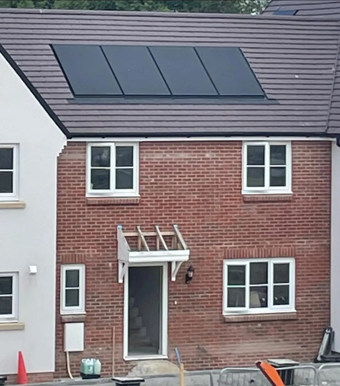 New-build house with rooftop PV panels and domestic wiring