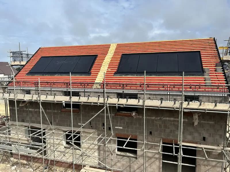 Solar panel installation across a pitched roof