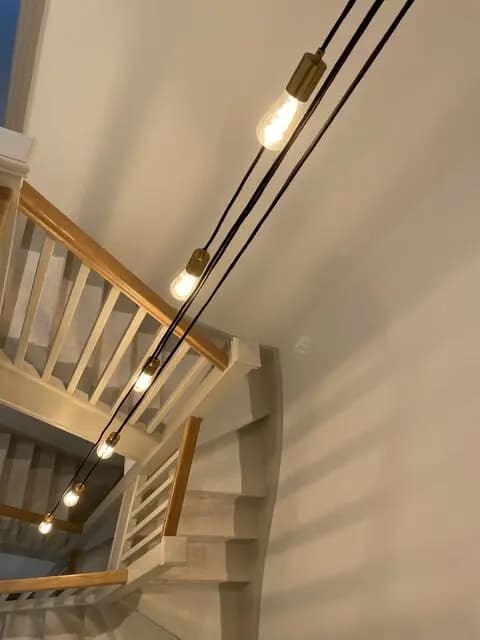 Stairwell fitted with hanging bulb lighting