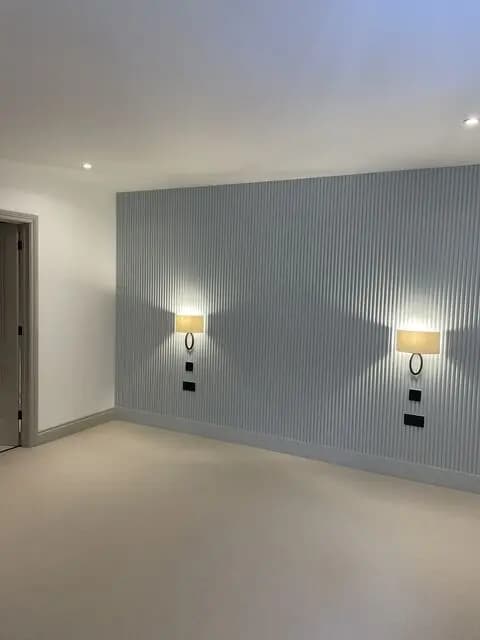 Room with wall sconce lighting